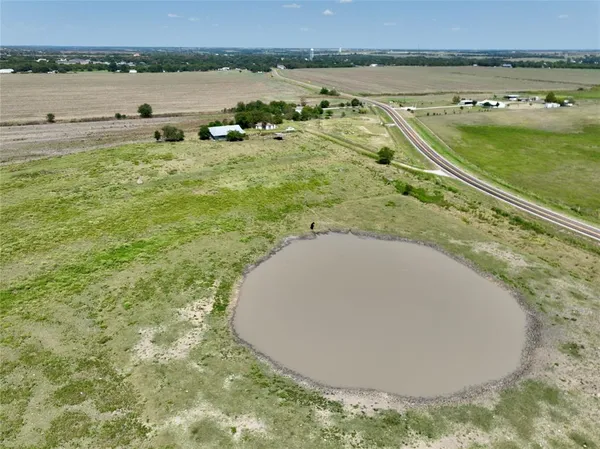 an aerial view of a house with a lake view