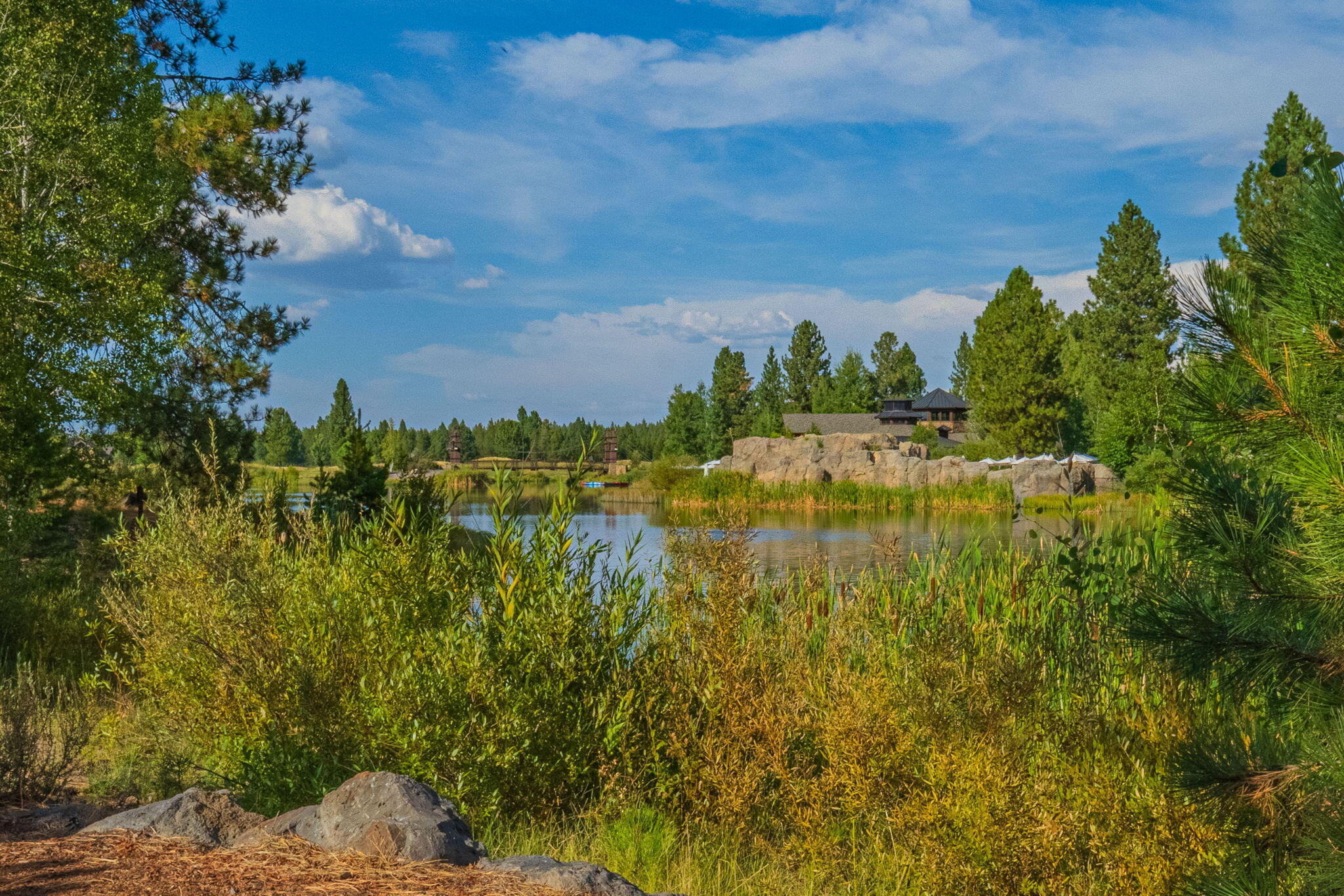 56508 Dancing Rock Loop, Unit 22 Bend, OR 97707 - Photo 5 of 69 Views across the Lake to the Lake House, Quarry Pool and Fitness Area
