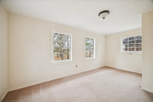 an empty room with windows