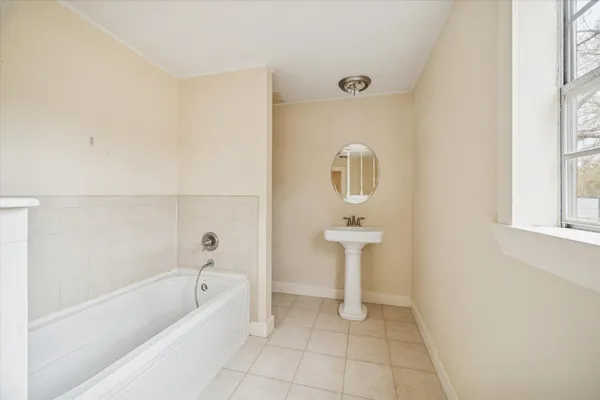 a bathroom with a sink a toilet and bathtub