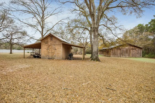 a view of a house with a snow in the yard