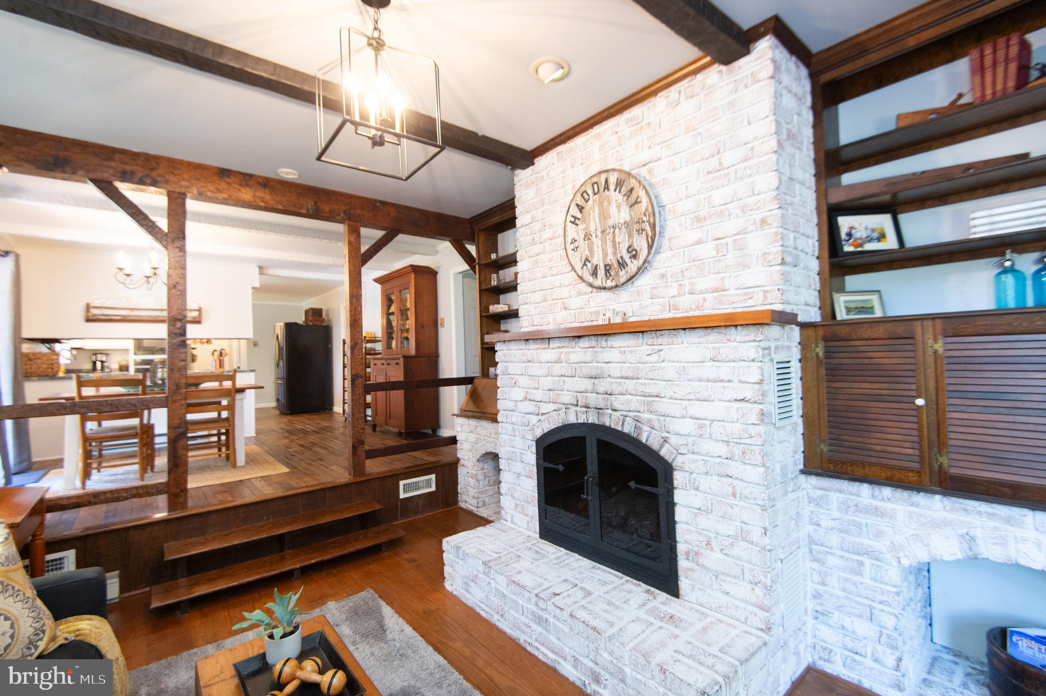 11 Shawnee Road Cambridge, MD 21613 - Photo 13 of 56 a living room with furniture and a fireplace