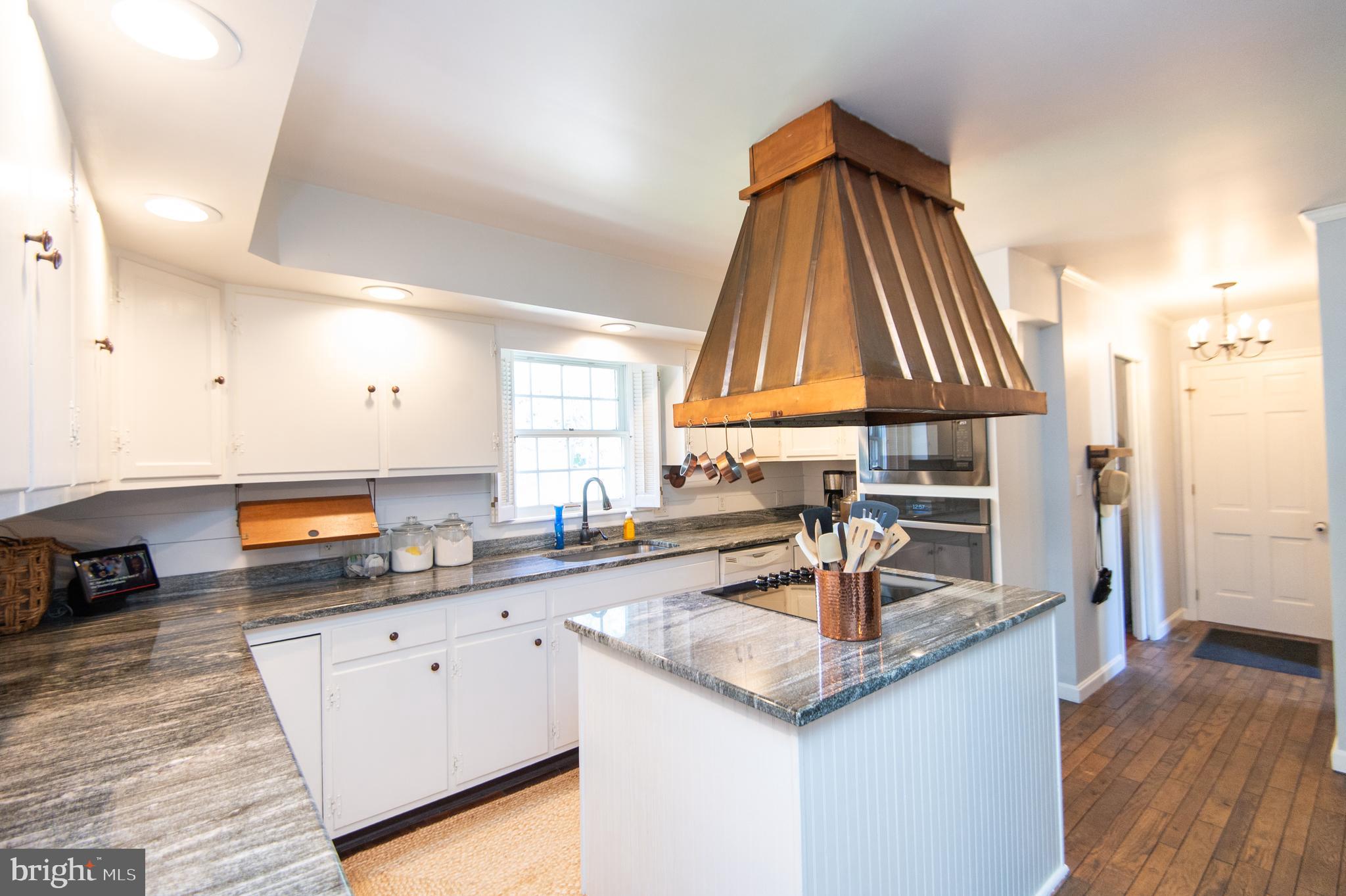 11 Shawnee Road Cambridge, MD 21613 - Photo 16 of 56 a kitchen with a sink and cabinets