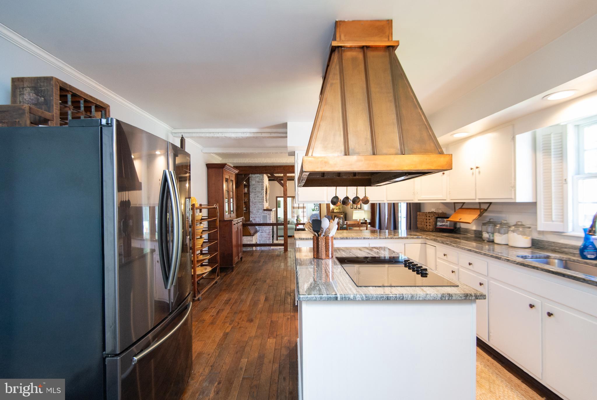 11 Shawnee Road Cambridge, MD 21613 - Photo 17 of 56 a kitchen with stainless steel appliances granite countertop a refrigerator and a sink