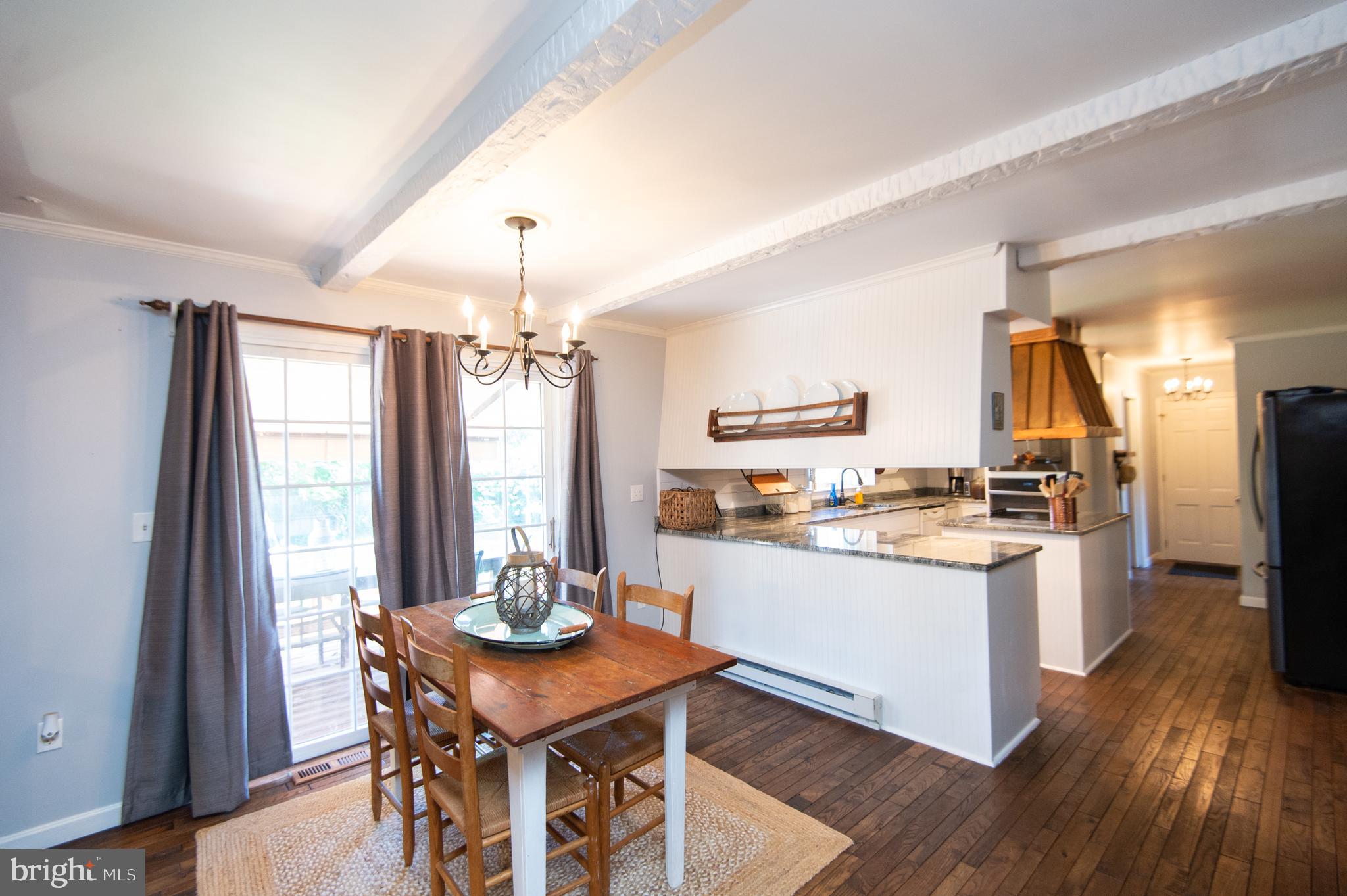 11 Shawnee Road Cambridge, MD 21613 - Photo 18 of 56 a kitchen with stainless steel appliances granite countertop a stove and refrigerator