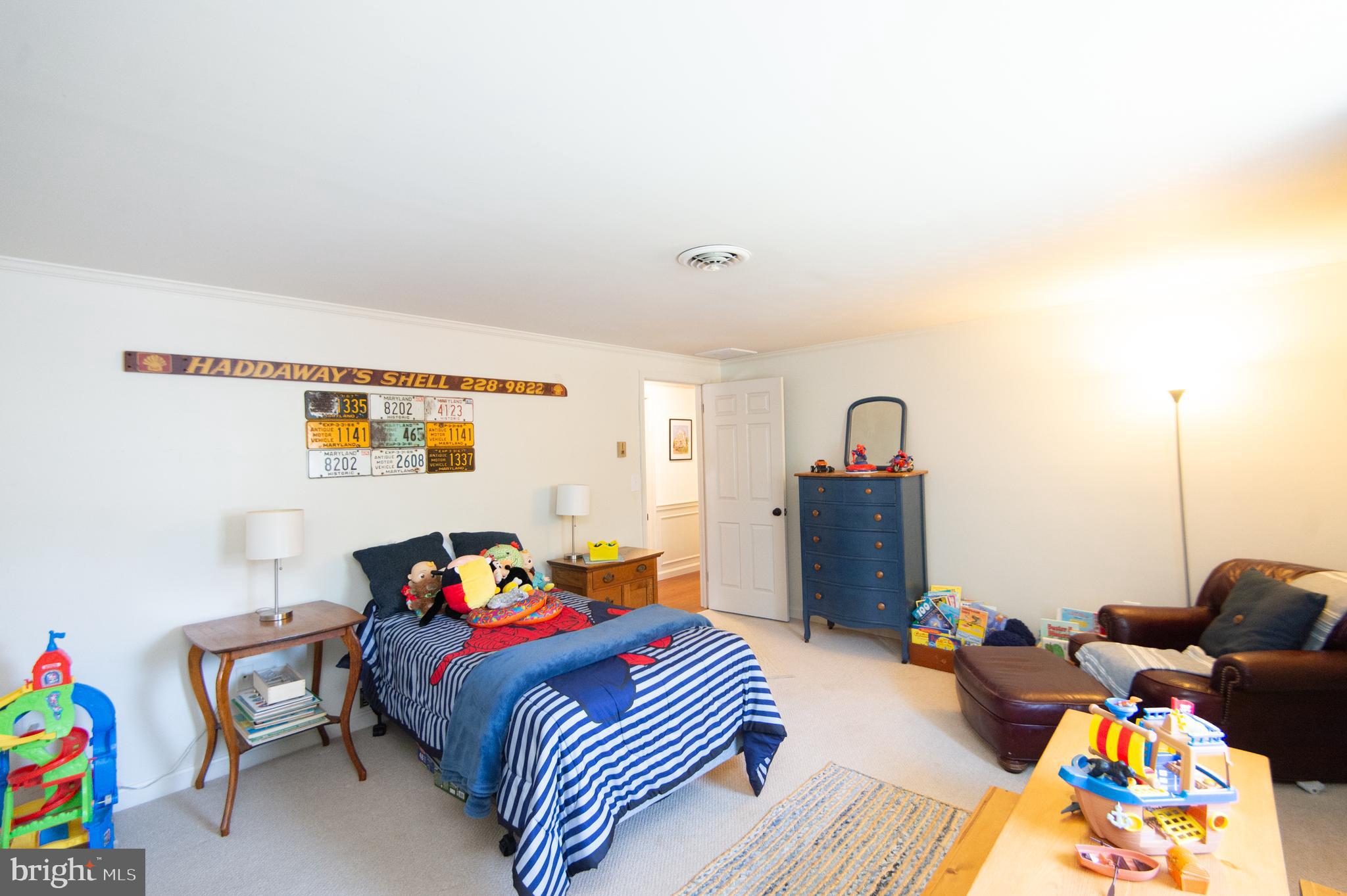 11 Shawnee Road Cambridge, MD 21613 - Photo 39 of 56 a bedroom with furniture and a baby crib