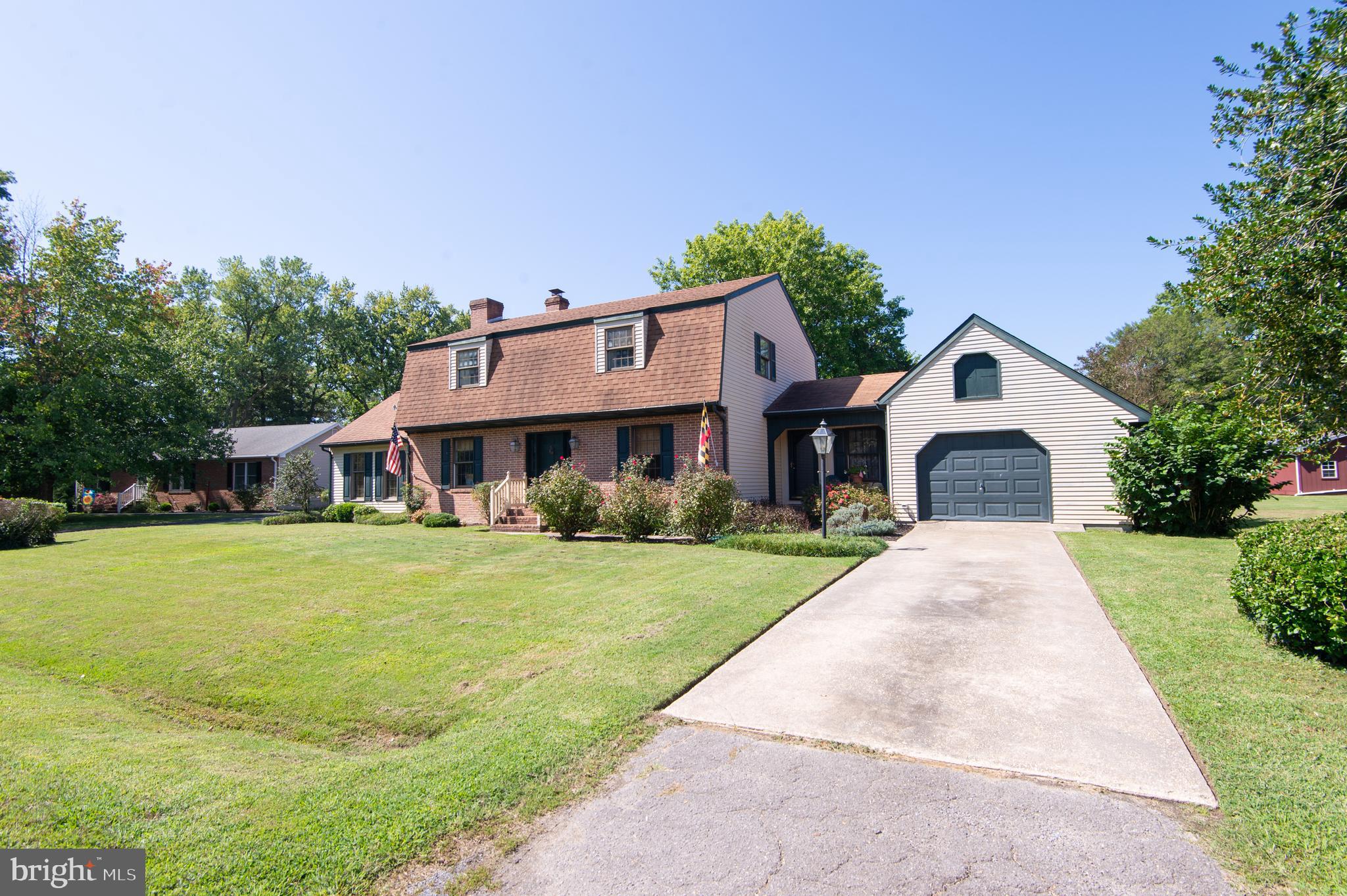 11 Shawnee Road Cambridge, MD 21613 - Photo 53 of 56 a front view of a house with a yard and trees
