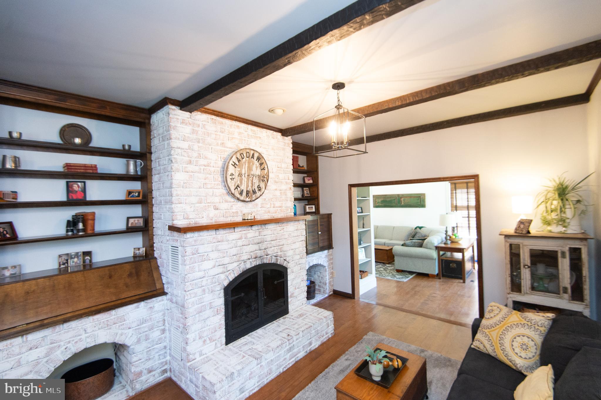 11 Shawnee Road Cambridge, MD 21613 - Photo 9 of 56 a living room with furniture and a fireplace