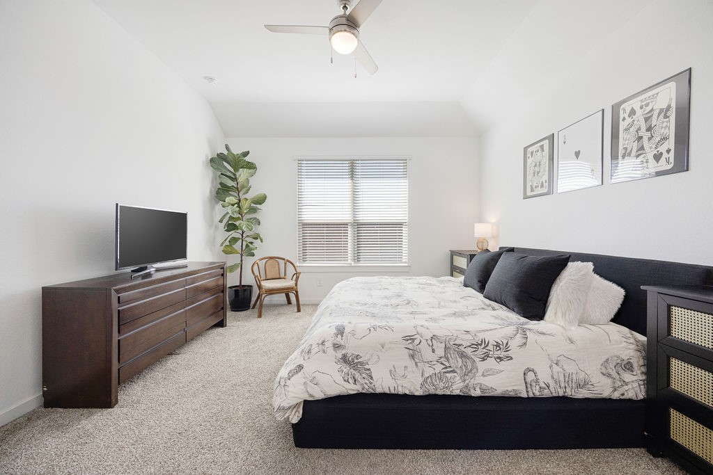 116 Solana Point Drive Katy, TX 77493 - Photo 5 of 31 The primary bedroom offers privacy and relaxation, with dual vanity sinks and a spacious walk-in closet