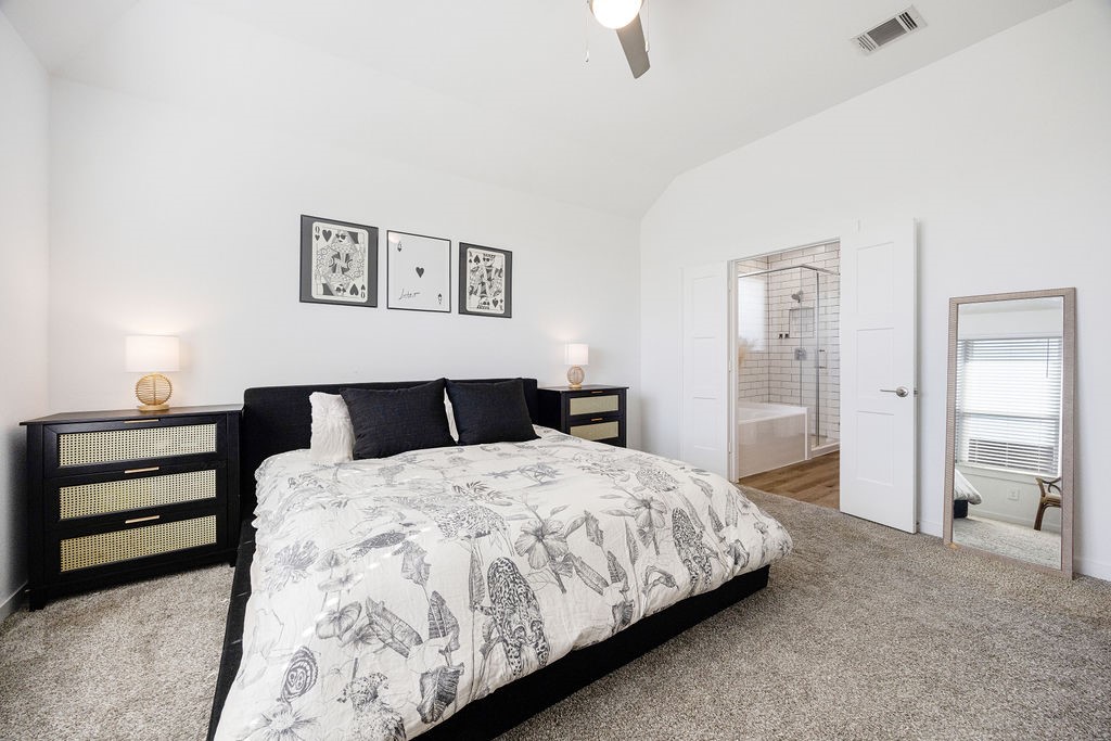 116 Solana Point Drive Katy, TX 77493 - Photo 6 of 31 The primary bedroom offers privacy and relaxation, with dual vanity sinks and a spacious walk-in closet