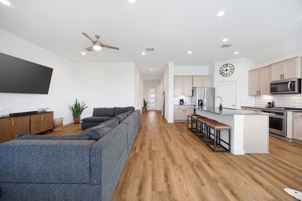 116 Solana Point Drive Katy, TX 77493 - Photo 31 of 31 The open floor plan flows seamlessly from the kitchen to the living room, ideal for the ins and outs of your everyday life.