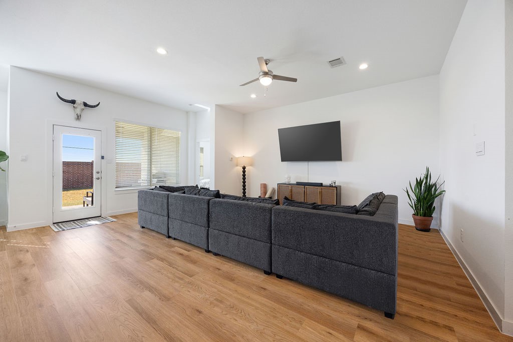 116 Solana Point Drive Katy, TX 77493 - Photo 27 of 31 The open floor plan flows seamlessly from the kitchen to the living room, ideal for the ins and outs of your everyday life.