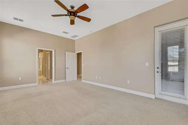 a spacious bathroom with a sink a mirror a bathtub and next to a window