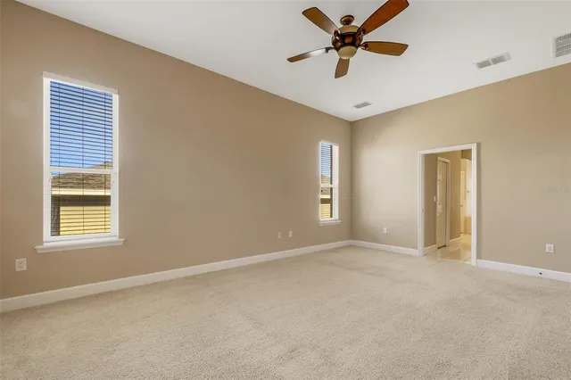 a bathroom with a tub a sink and a mirror