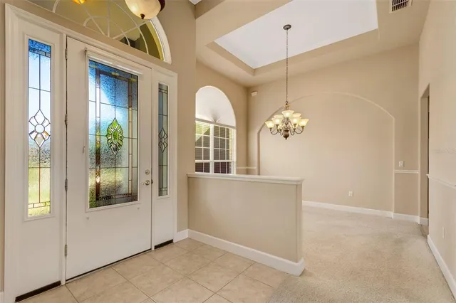 a view of a room with a windows and cabinet