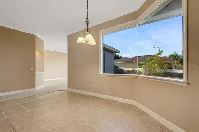 a kitchen with granite countertop a sink a stove and a refrigerator