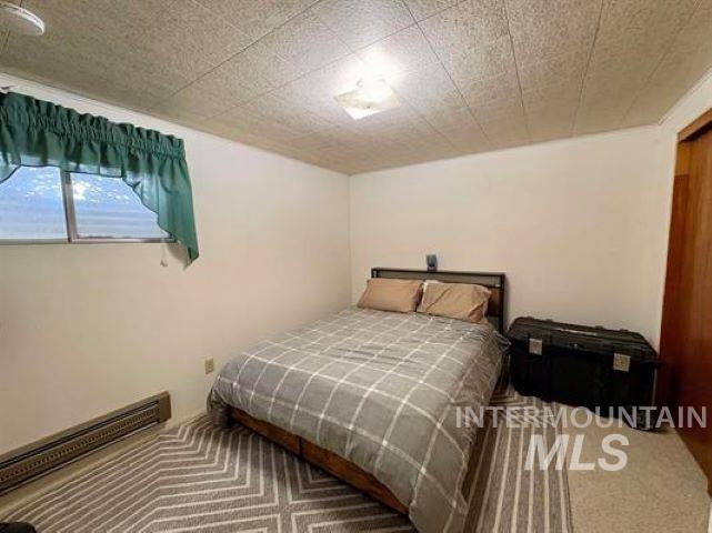 3197 Neeley Road American Falls, ID 83211 - Photo 33 of 45 Neutral-toned walls complement the textured ceiling tiles and recessed lighting fixture