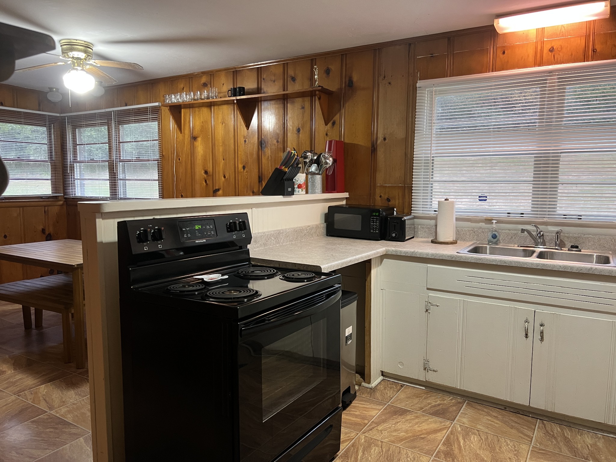 355 Chicken Creek Road Pulaski, TN 38478 - Photo 9 of 17 a kitchen with a stove and a sink