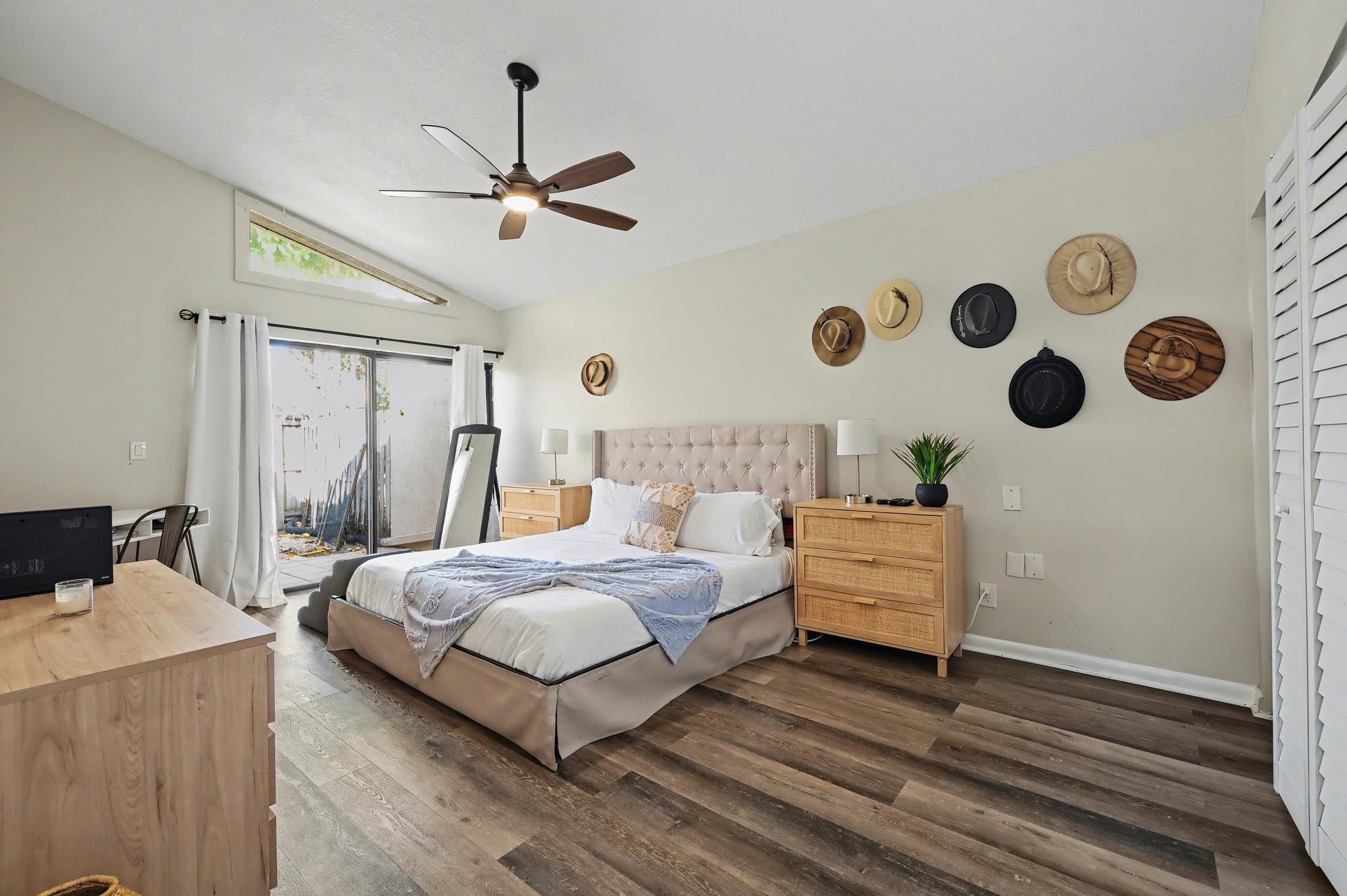 7855 Stanway Place Boca Raton, FL 33433 - Photo 11 of 24 a bedroom with a bed and a chandelier