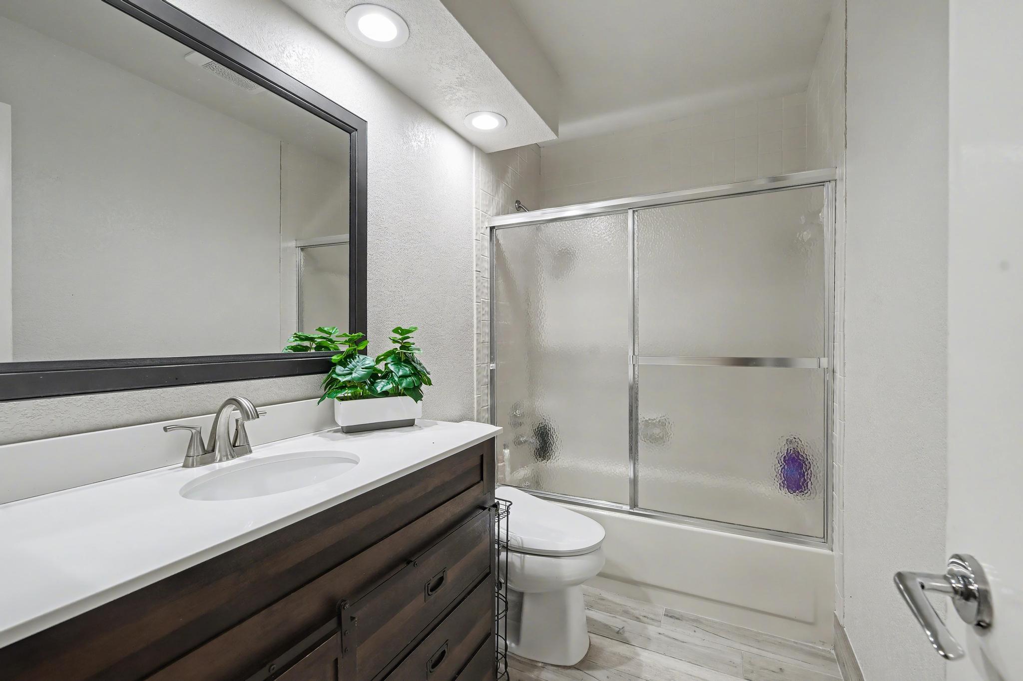 7855 Stanway Place Boca Raton, FL 33433 - Photo 18 of 24 a bathroom with a granite countertop sink toilet and shower