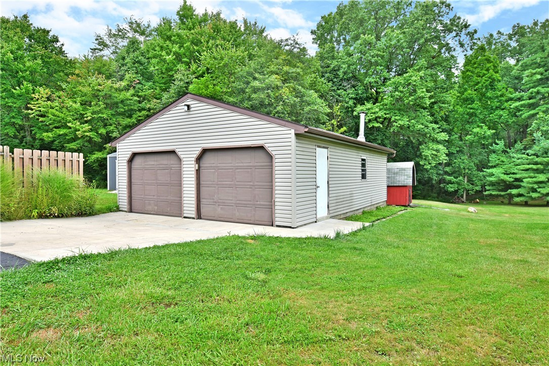 1711 Salt Springs Road Mineral Ridge, OH 44440 - Photo 33 of 35 Garage featuring garage and a yard