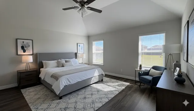 a bedroom with a bed a desk and chair