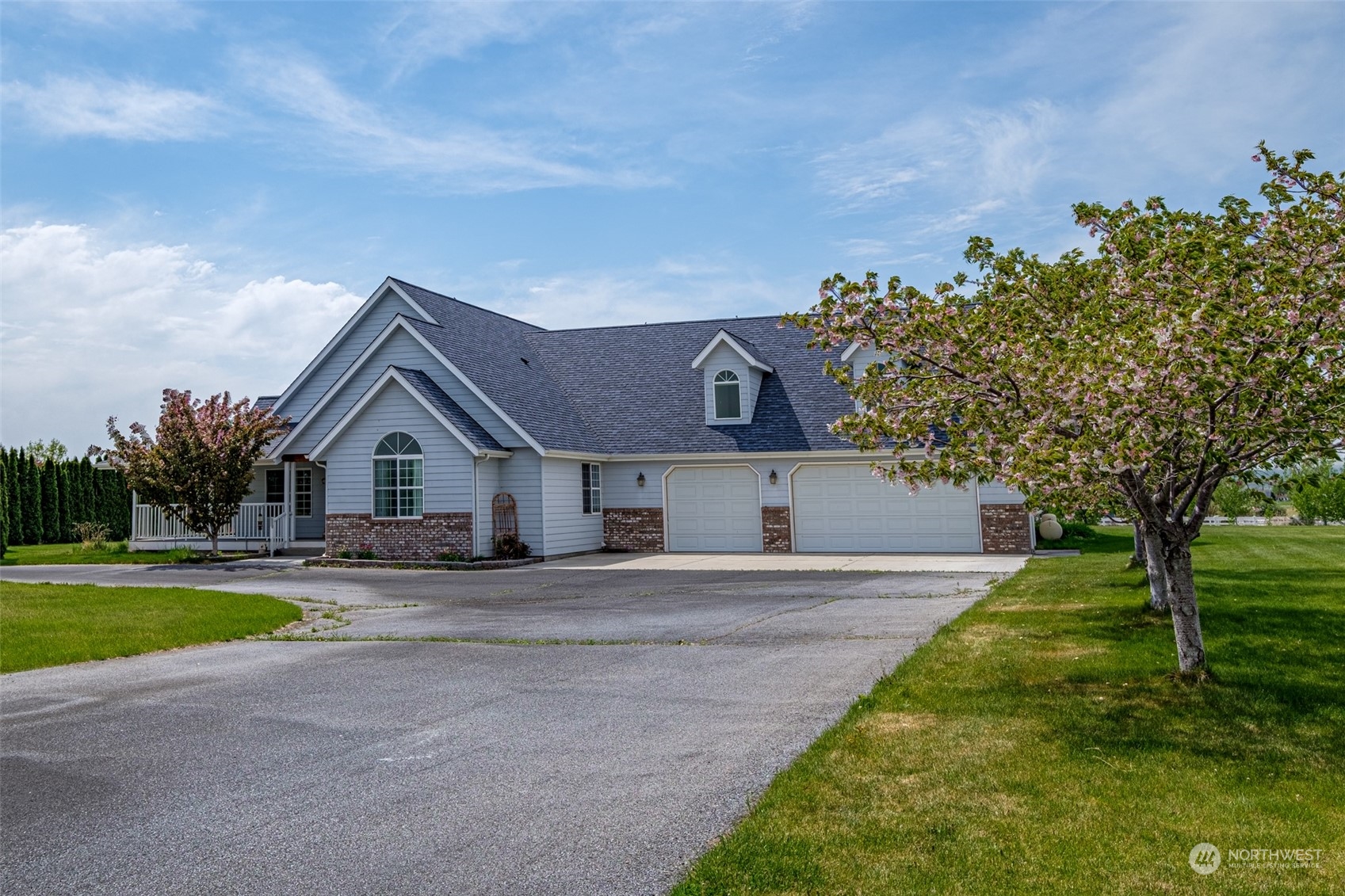 12872 Rd B.7 Northwest Ephrata, WA 98823 - Photo 24 of 33 a front view of a house with a yard and garage