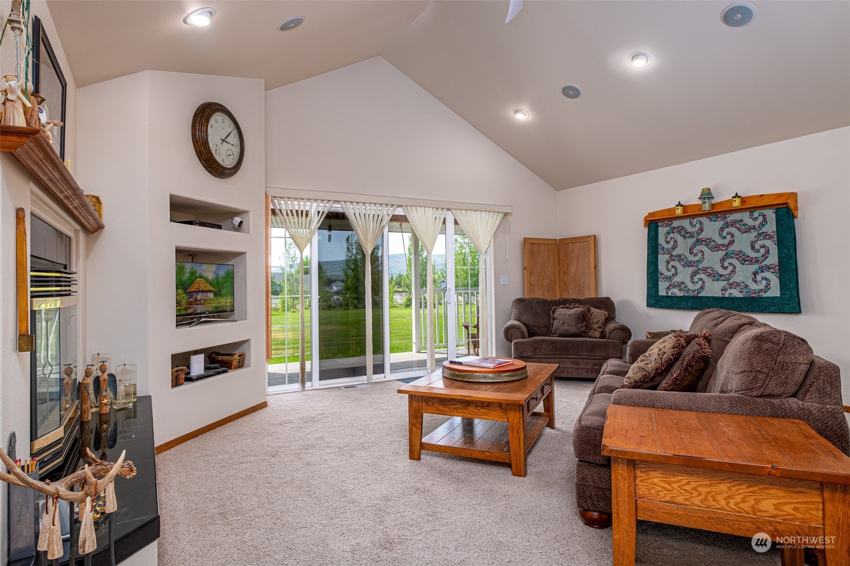 12872 Rd B.7 Northwest Ephrata, WA 98823 - Photo 6 of 33 a living room with furniture a floor to ceiling window and a flat screen tv