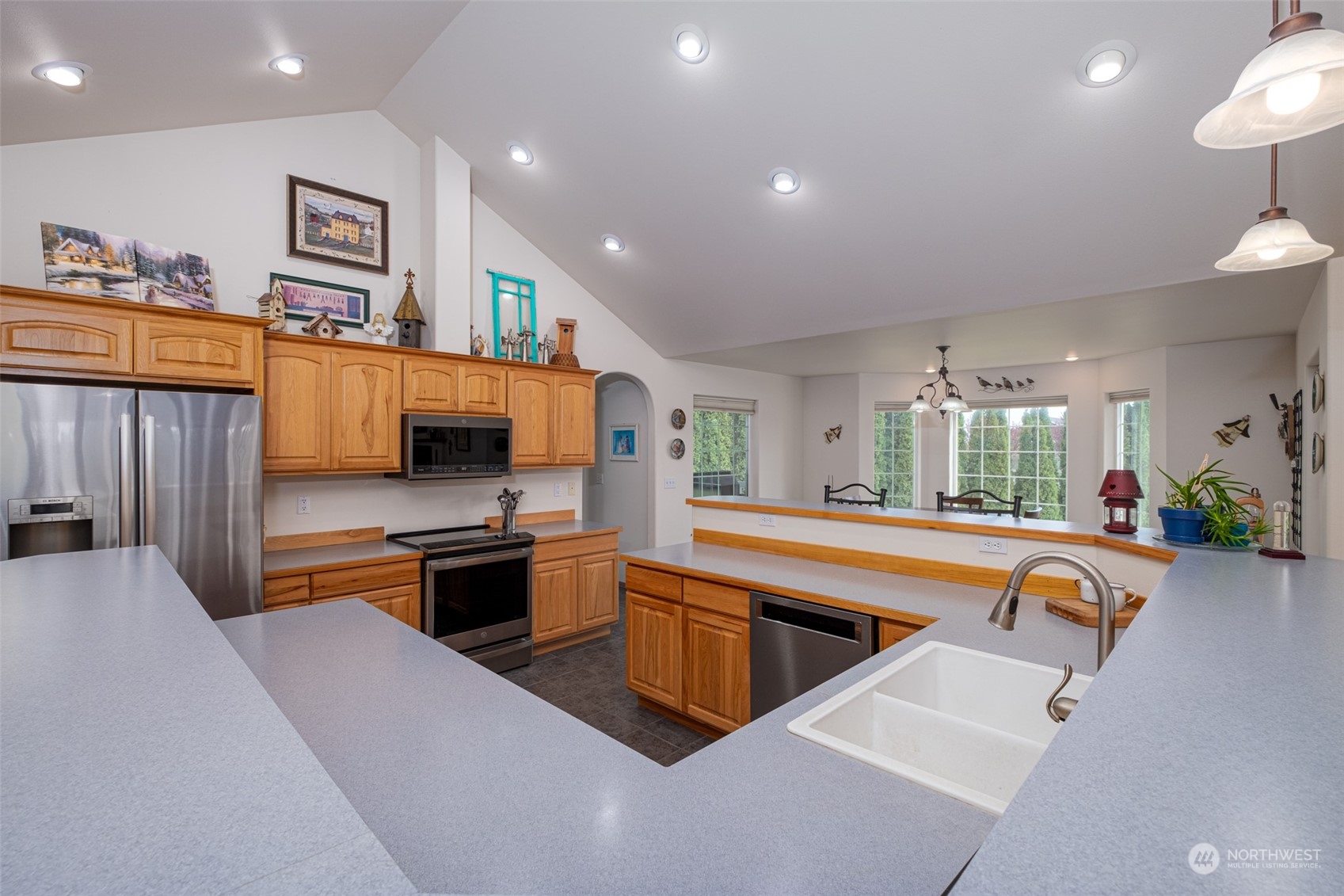 12872 Rd B.7 Northwest Ephrata, WA 98823 - Photo 10 of 33 a kitchen with stainless steel appliances granite countertop a sink and a refrigerator