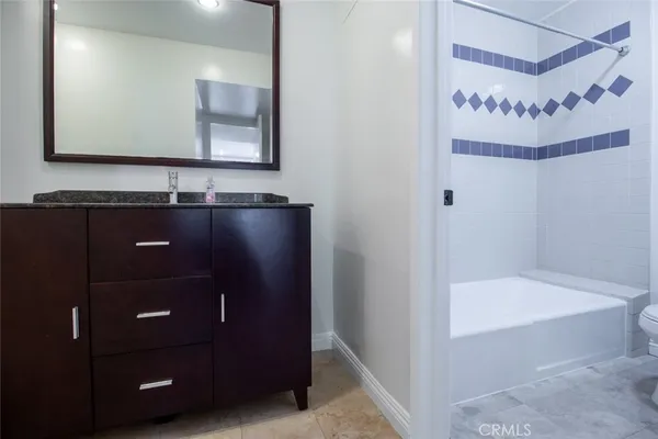 a bathroom with a bathtub and a sink