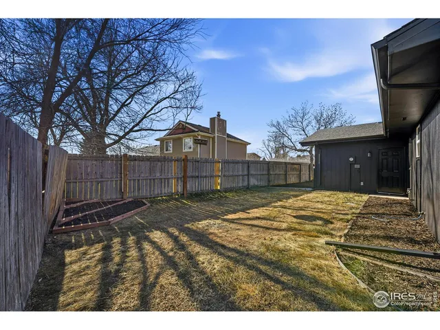 a view of a backyard of the house