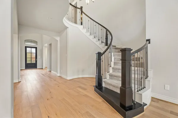 a view of entryway with wooden floor