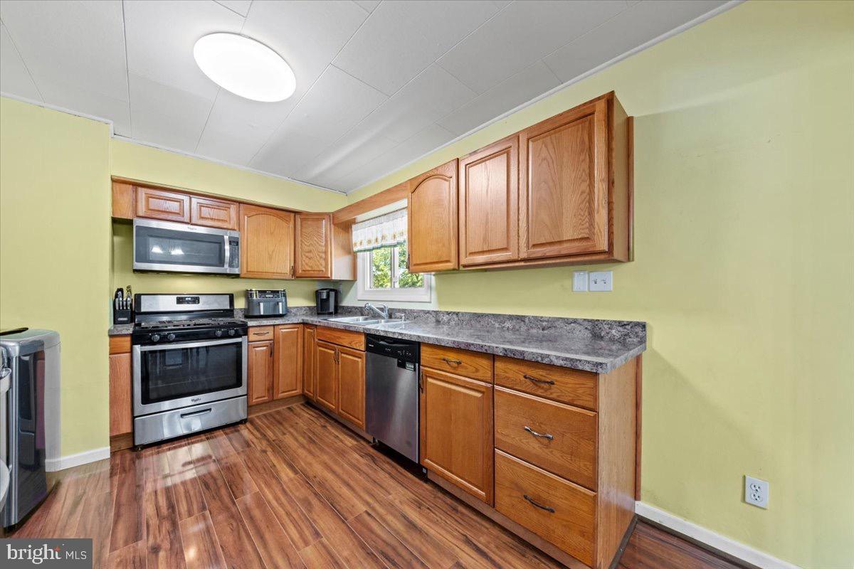 3 High Ridge Drive Pemberton, NJ 08068 - Photo 6 of 24 a kitchen with stainless steel appliances granite countertop a stove and a sink
