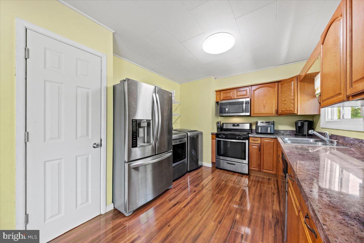 3 High Ridge Drive Pemberton, NJ 08068 - Photo 7 of 24 a kitchen with stainless steel appliances granite countertop a refrigerator a stove top oven a sink and dishwasher