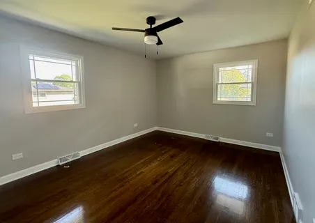 a view of room window and wooden floor