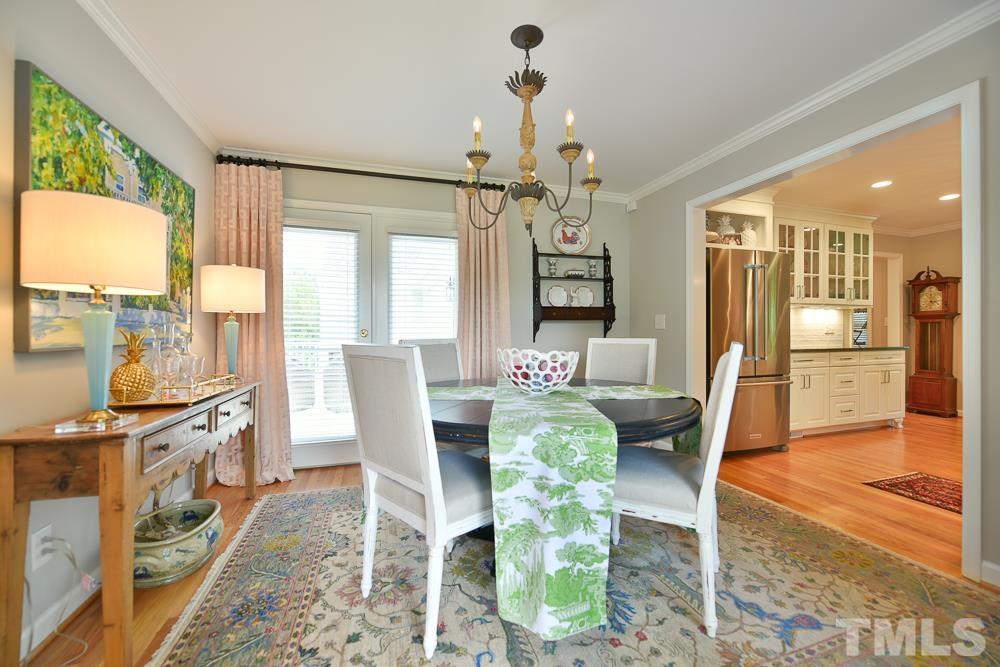 1504 Rolesville Road Wake Forest, NC 27587 - Photo 8 of 21 a view of a dining room with furniture window and wooden floor