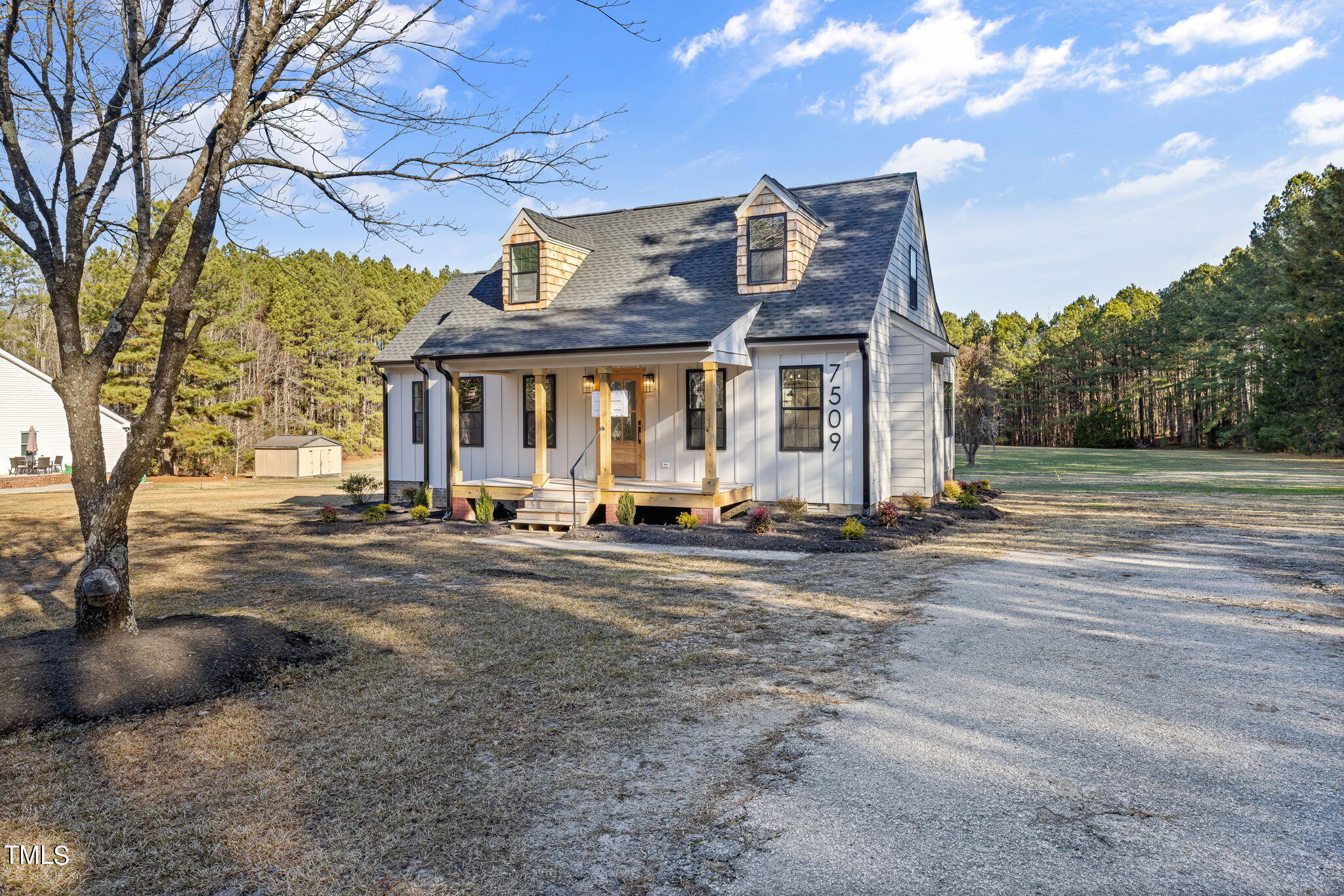 7509 Riley Hill Road Zebulon, NC 27597 - Photo 4 of 37 a front view of a house with a yard