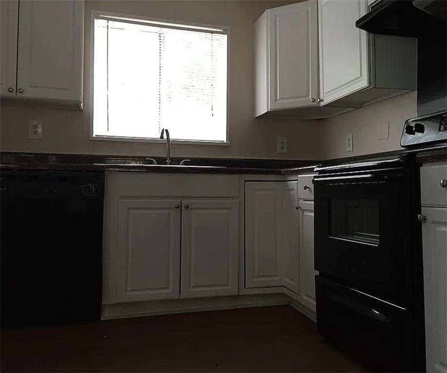 4097 Clay Drive Atlanta, GA 30360 - Photo 3 of 8 a kitchen with granite countertop white cabinets and black appliances