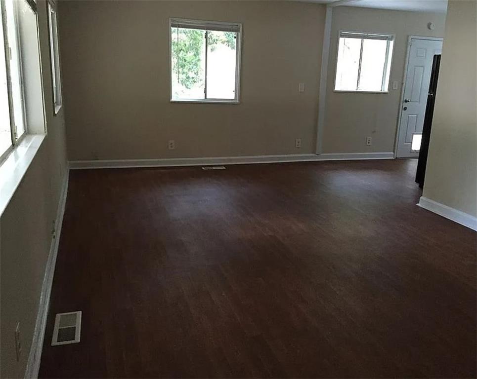 4097 Clay Drive Atlanta, GA 30360 - Photo 5 of 8 an empty room with wooden floor and windows