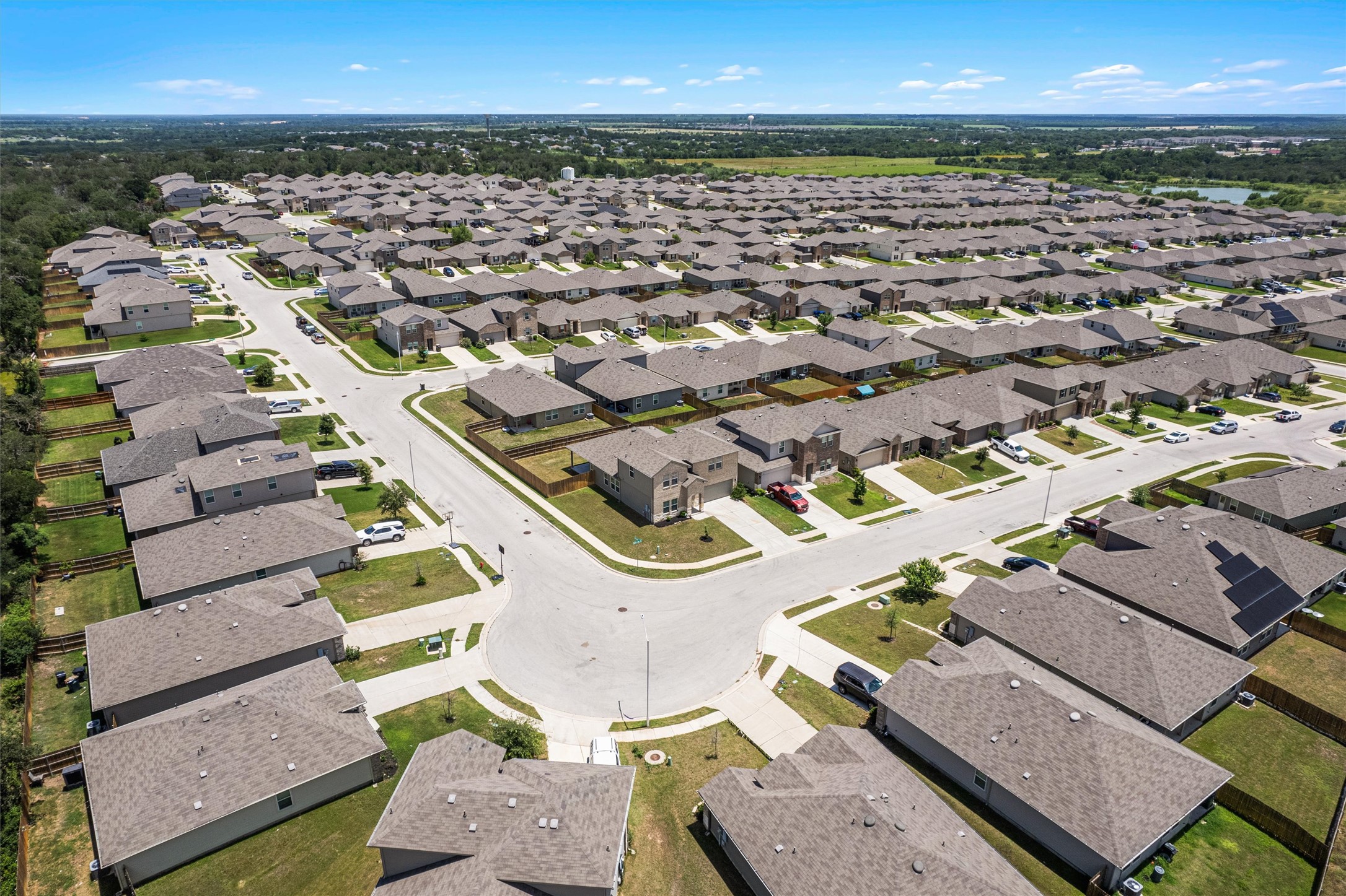 6121 Ronee Leah Drive Austin, TX 78724 - Photo 30 of 30 An aerial panorama reveals a vast, well-maintained neighborhood with uniform residences and pristine landscaping.