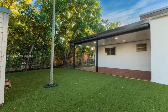a backyard of a house with lots of green space