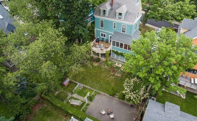 an aerial view of a house with a garden