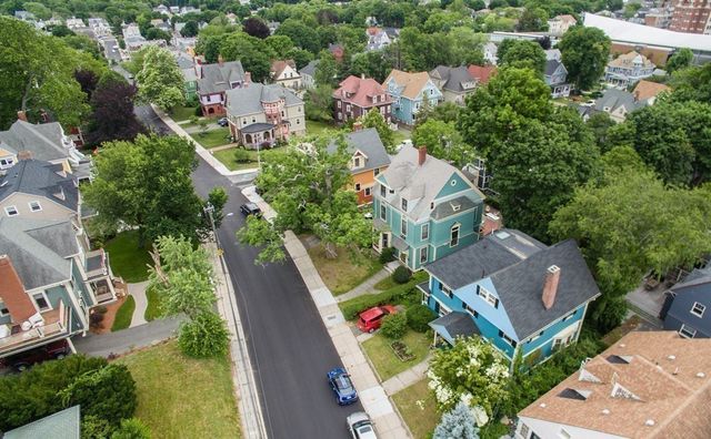 an aerial view of residential house with outdoor space and street view