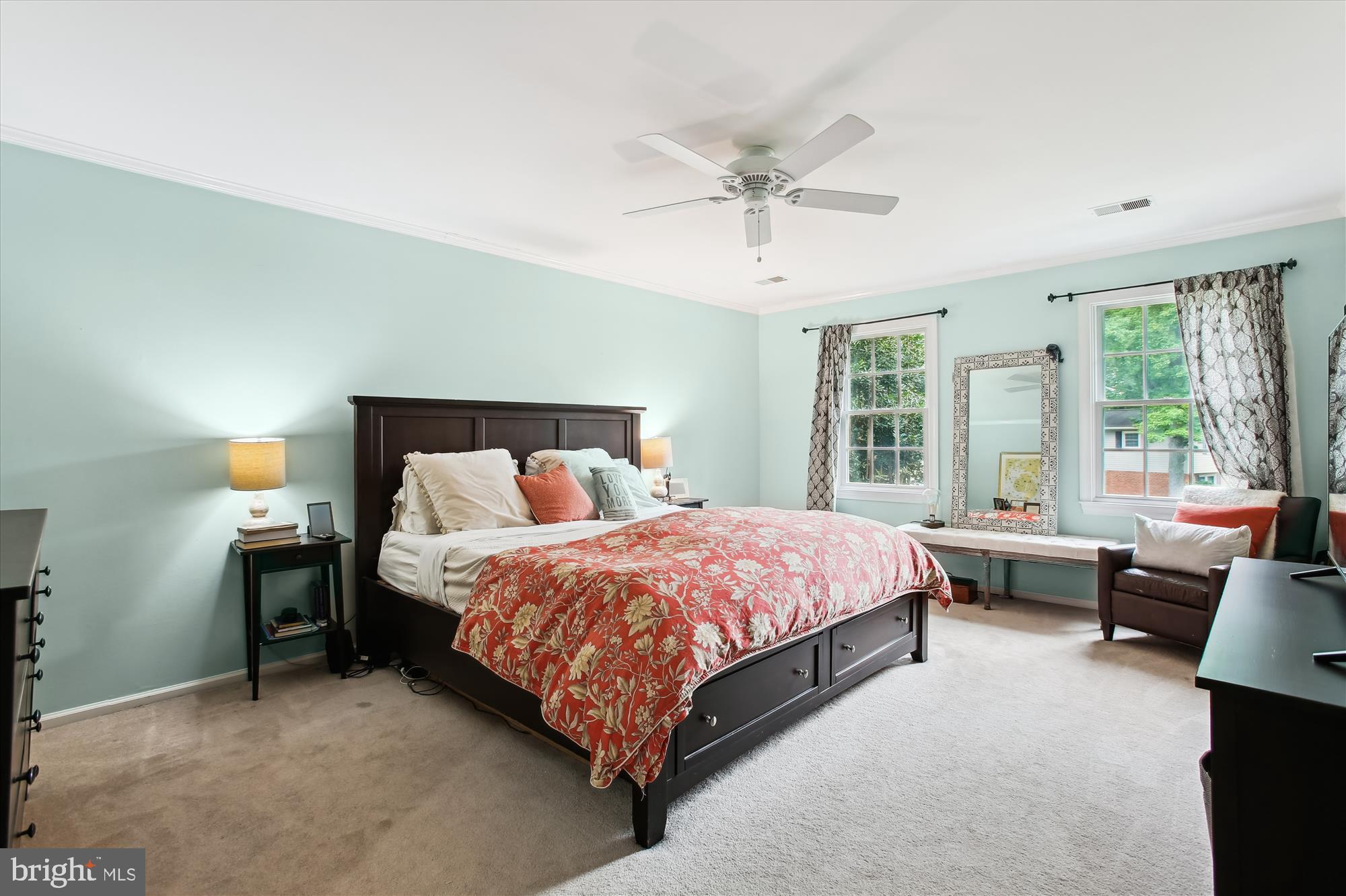 8231 Crown Court Road Alexandria, VA 22308 - Photo 18 of 33 a bedroom with a bed and a chandelier