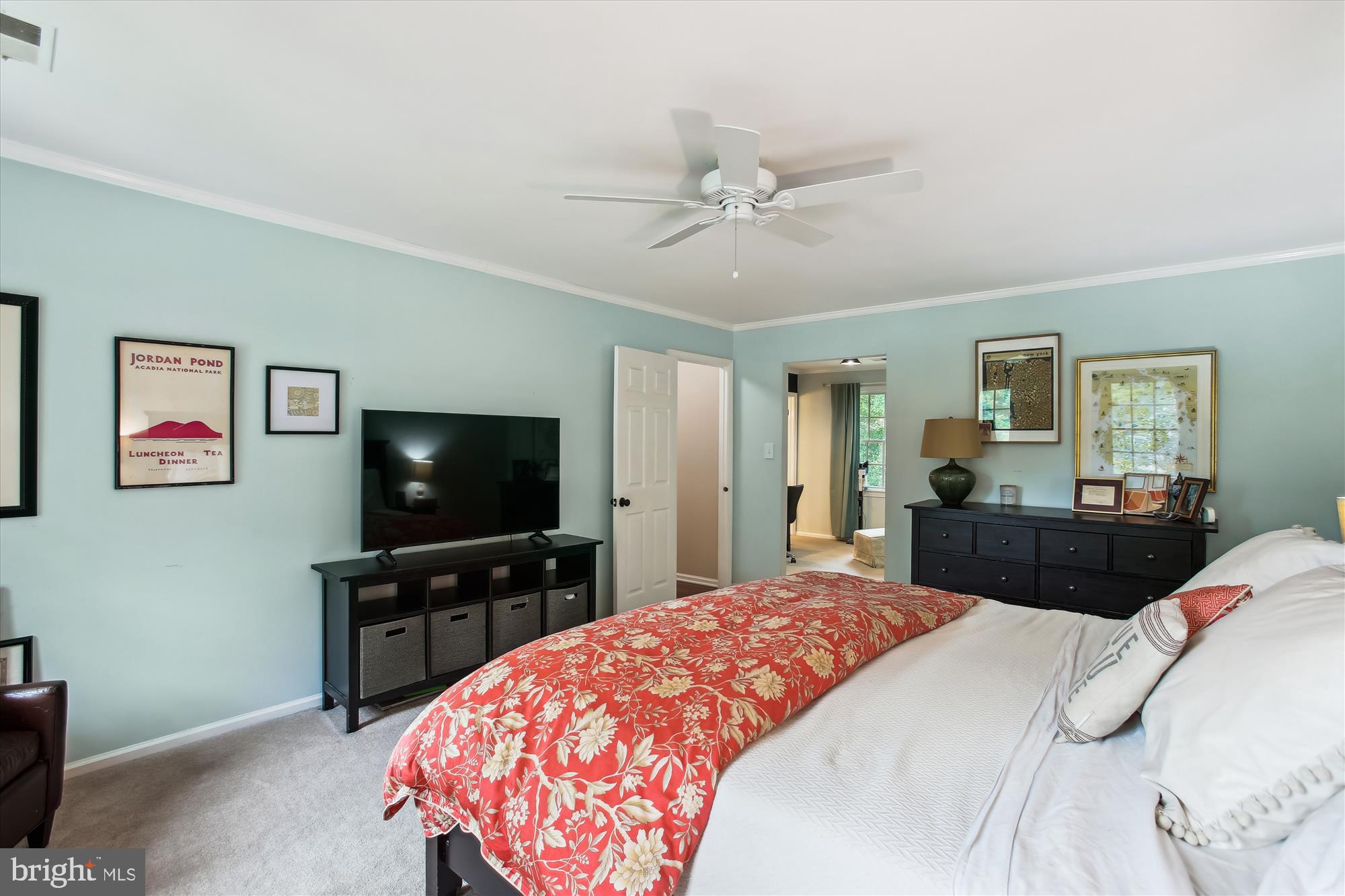 8231 Crown Court Road Alexandria, VA 22308 - Photo 19 of 33 a bedroom with a bed and a flat screen tv