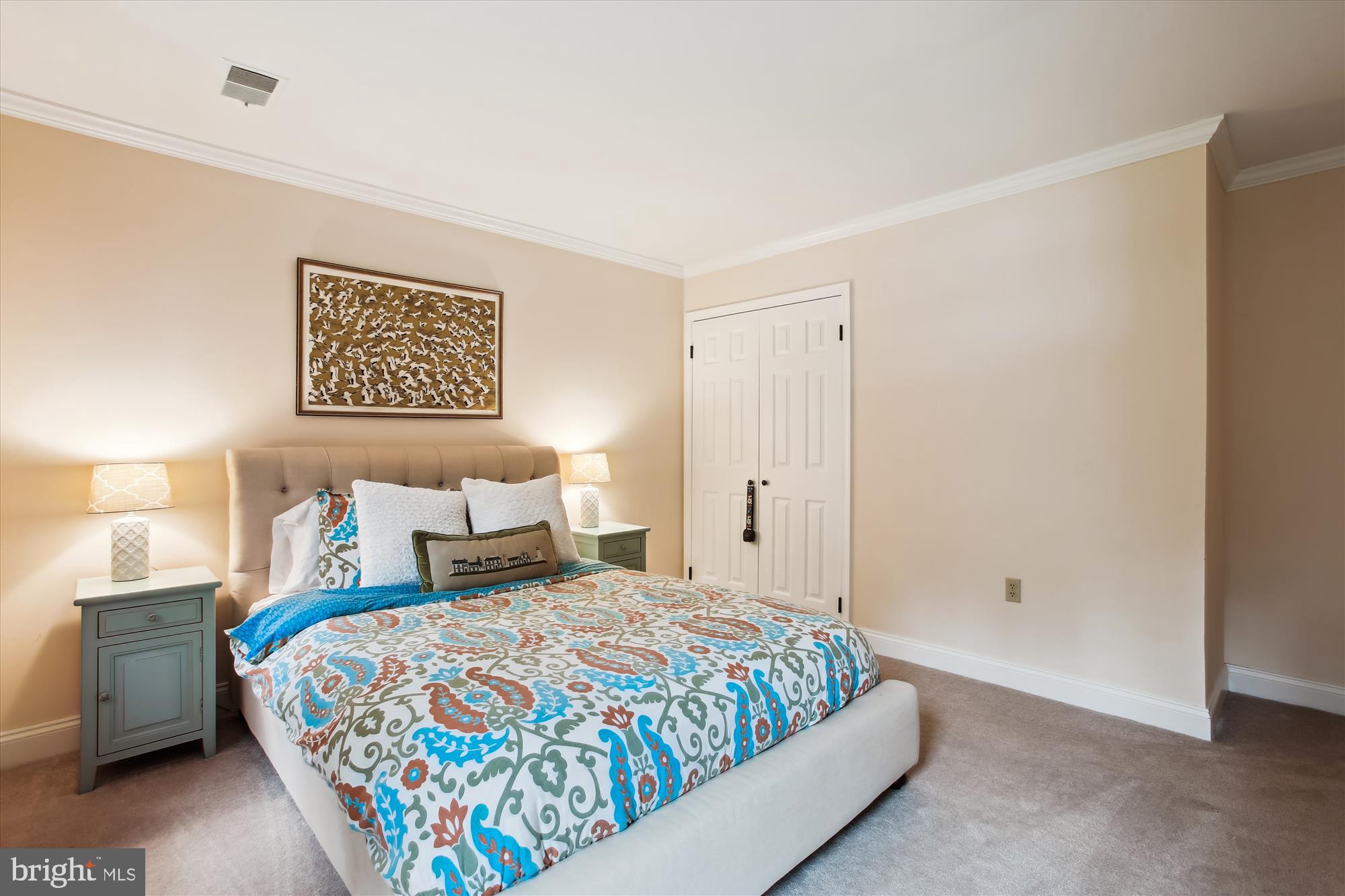 8231 Crown Court Road Alexandria, VA 22308 - Photo 24 of 33 a bedroom with a bed and painting on the wall