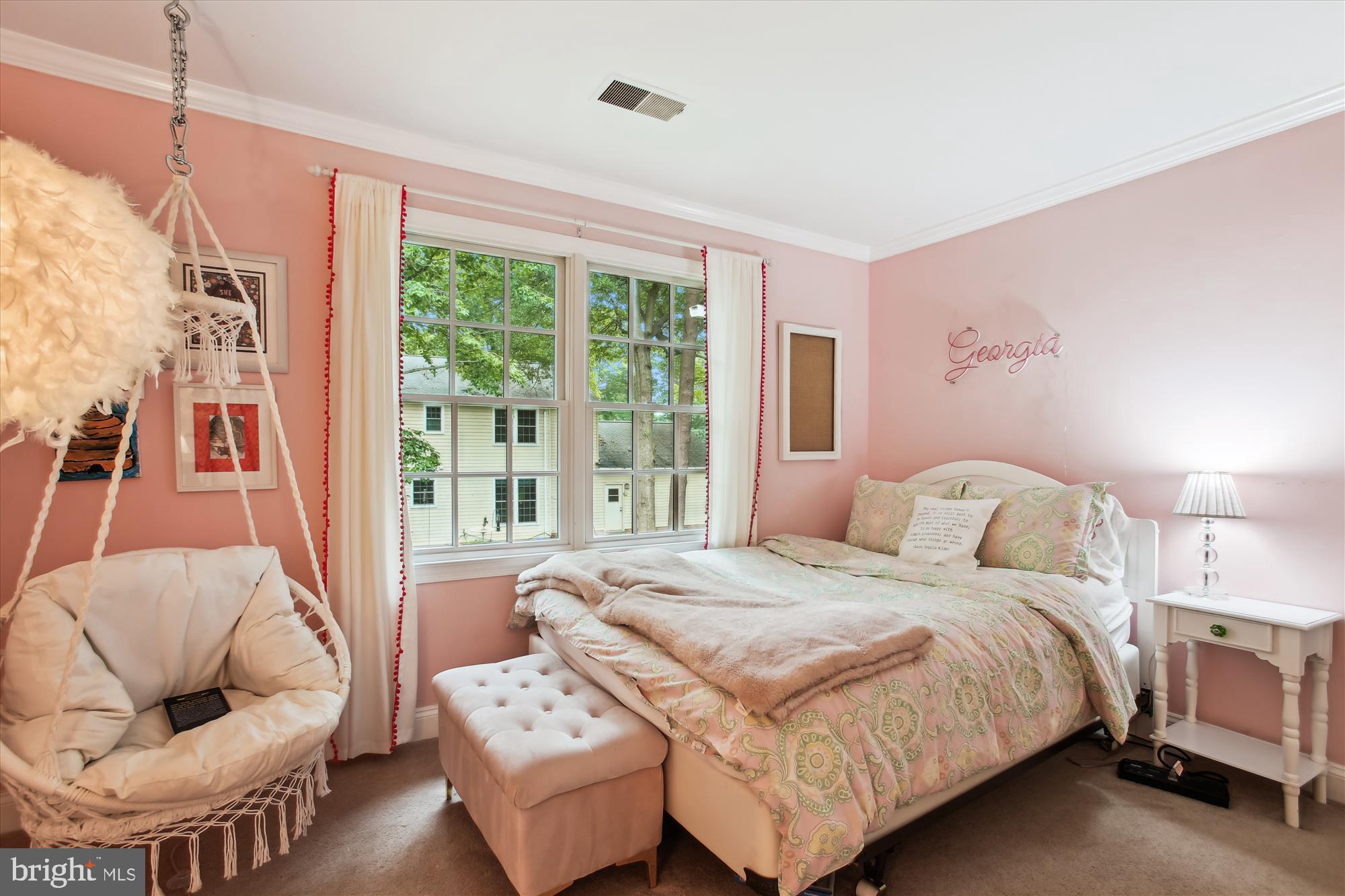8231 Crown Court Road Alexandria, VA 22308 - Photo 26 of 33 a bedroom with a bed and glass window