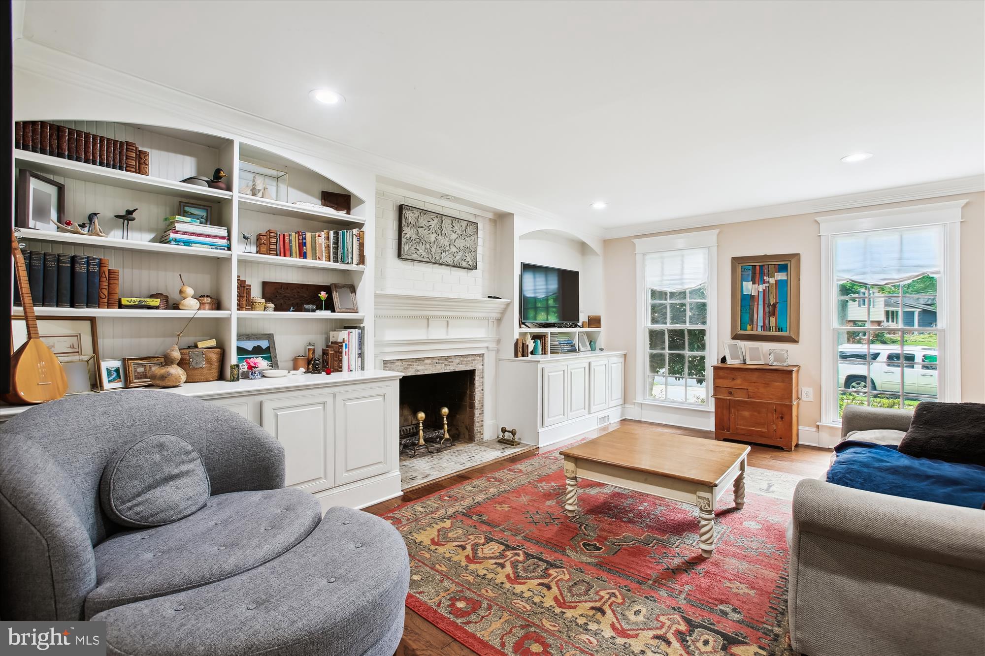 8231 Crown Court Road Alexandria, VA 22308 - Photo 3 of 33 a living room with furniture and a fireplace