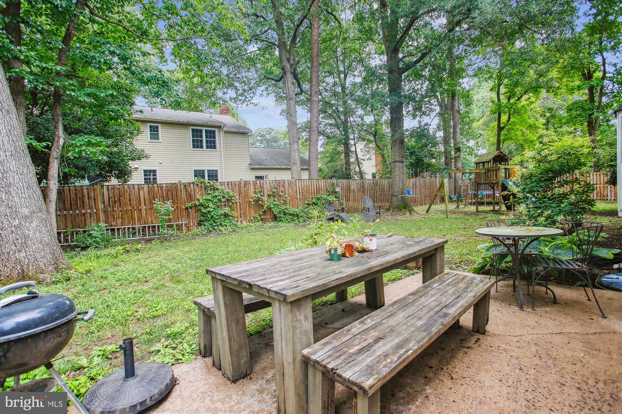 8231 Crown Court Road Alexandria, VA 22308 - Photo 31 of 33 a view of a deck with furniture and garden