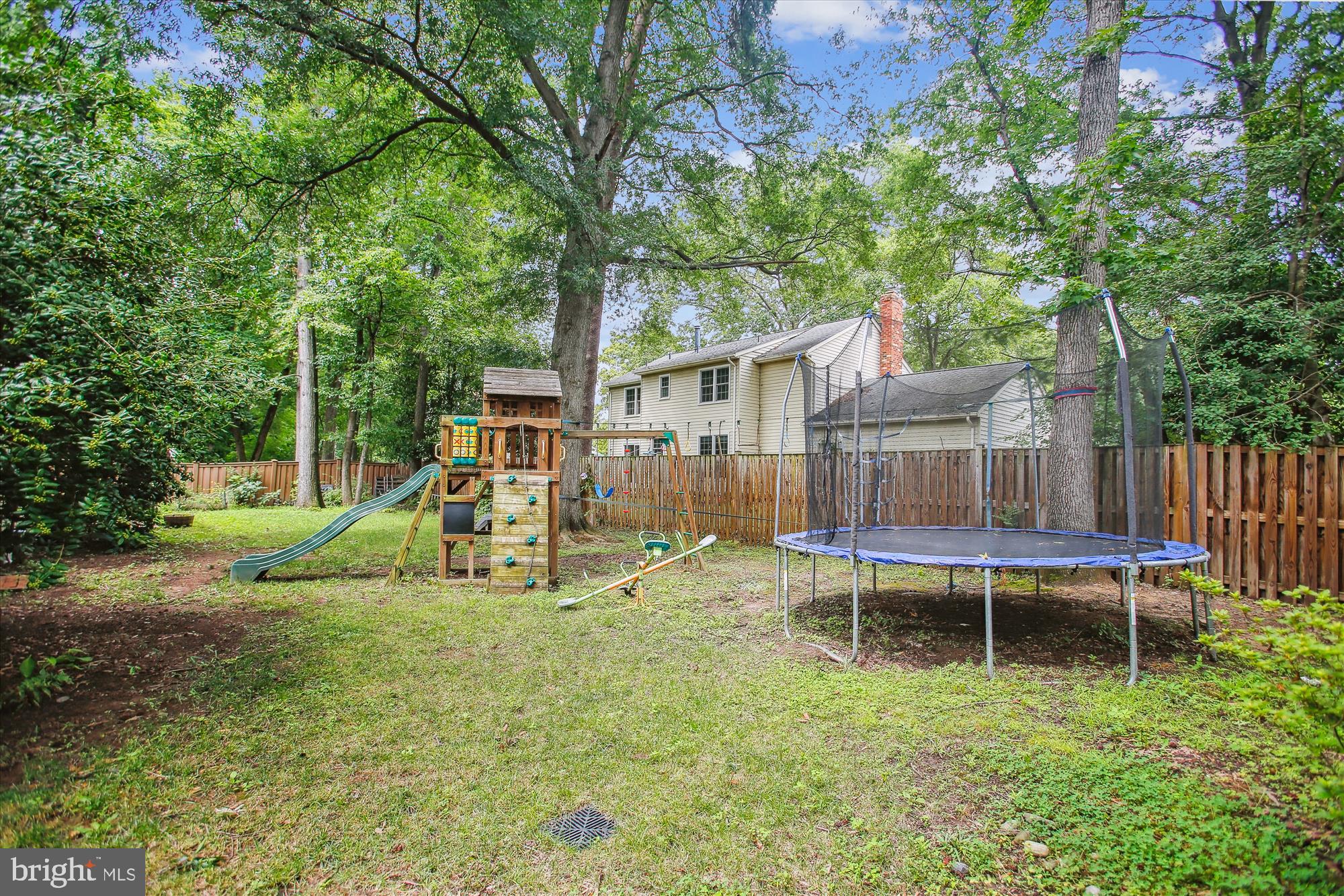 8231 Crown Court Road Alexandria, VA 22308 - Photo 33 of 33 a view of a house with backyard and sitting area